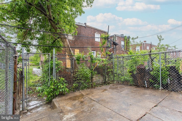 view of patio / terrace with fence and a gate