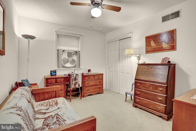 office space featuring a ceiling fan and carpet