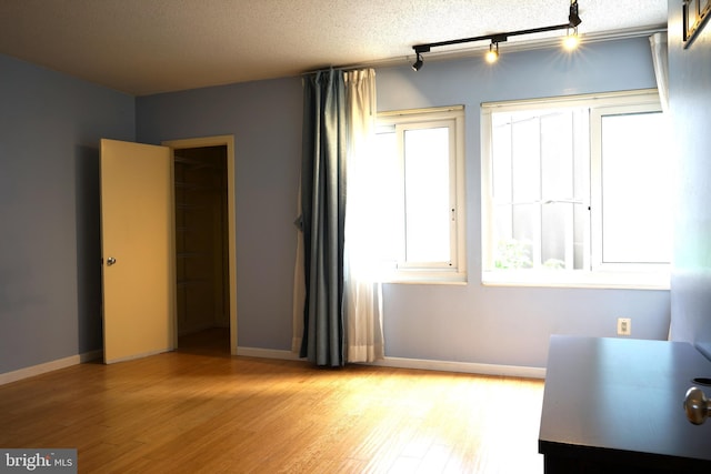 office area with light wood finished floors and baseboards