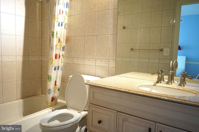 full bath featuring shower / tub combo with curtain, vanity, tile walls, and toilet