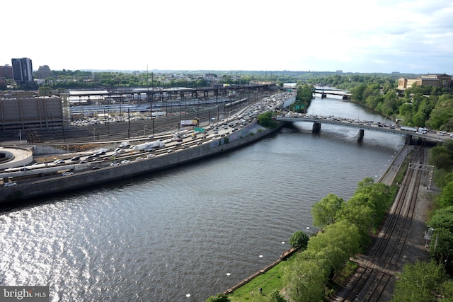 bird's eye view of a notable bridge, a highway, and a nearby body of water