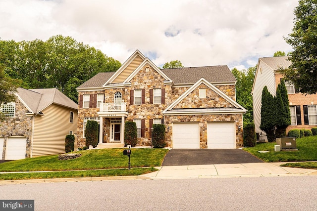 15602 Sir Edwards Dr, Upper Marlboro, MD 20772 - view of front facade with stone siding, asphalt driveway, a front lawn, a garage, and roof with shingles