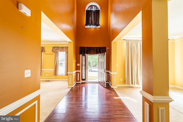 15602 Sir Edwards Dr, Upper Marlboro, MD 20772 - foyer featuring a high ceiling, wood finished floors, baseboards, carpet flooring, and crown molding