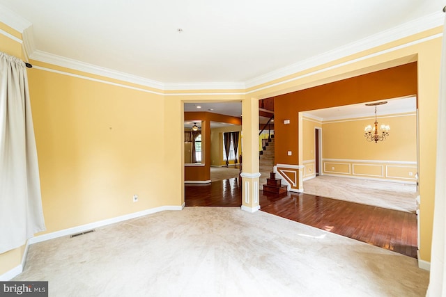 15602 Sir Edwards Dr, Upper Marlboro, MD 20772 - unfurnished bedroom with ornamental molding, carpet floors, a chandelier, wood finished floors, and a wainscoted wall
