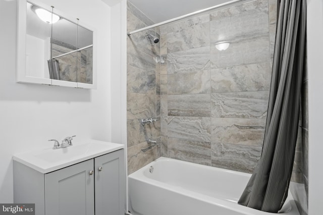 full bathroom with shower / bath combo with shower curtain and vanity