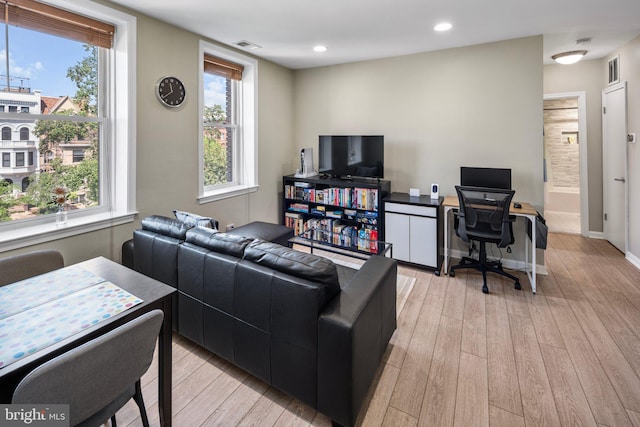 2001 16th St NW Unit 307, Washington, DC 20009 - living room featuring light wood-type flooring, a desk, recessed lighting, and baseboards