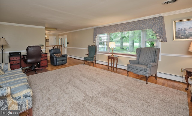office space with wood finished floors, ornamental molding, a baseboard heating unit, baseboard heating, and baseboards