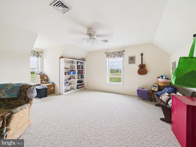 20852 Country Rd, Georgetown, DE 19947 - sitting room featuring healthy amount of natural light, vaulted ceiling, a ceiling fan, and carpet floors