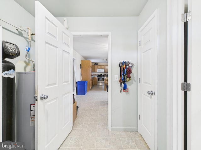 20852 Country Rd, Georgetown, DE 19947 - hall with electric water heater, light tile patterned floors, and baseboards
