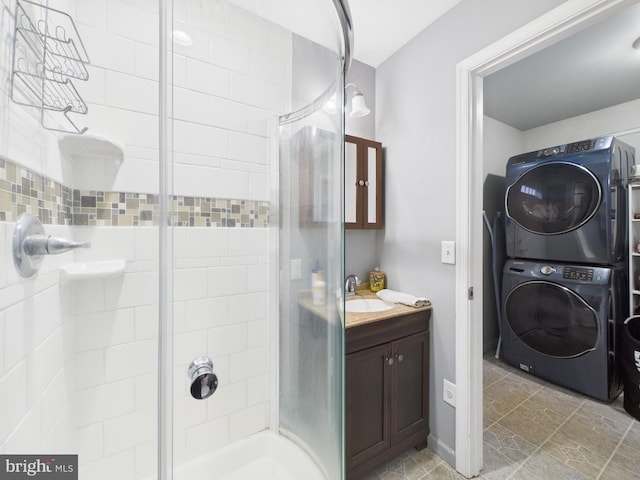 20852 Country Rd, Georgetown, DE 19947 - full bathroom with stacked washer / dryer, a shower stall, and vanity