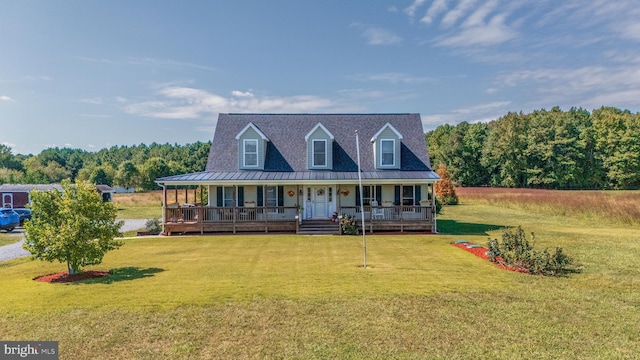 20852 Country Rd, Georgetown, DE 19947 - view of front of house with a porch, a front lawn, metal roof, and a standing seam roof