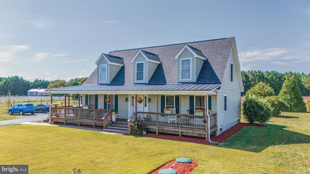 20852 Country Rd, Georgetown, DE 19947 - view of front of property with a standing seam roof, a porch, metal roof, a front lawn, and crawl space