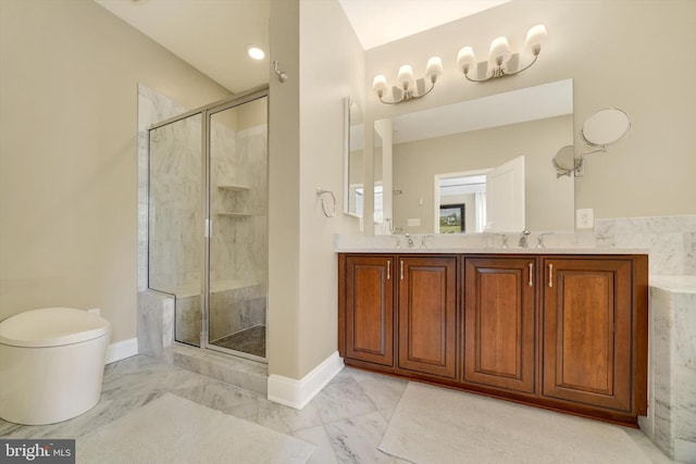 full bath with marble look tile flooring, a stall shower, double vanity, toilet, and baseboards