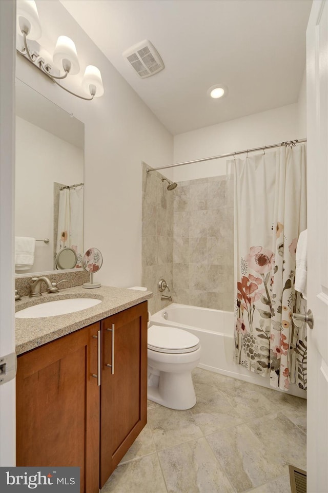 bathroom with shower / bath combo, toilet, and vanity