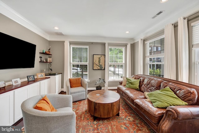 living room with ornamental molding, recessed lighting, baseboards, and wood finished floors