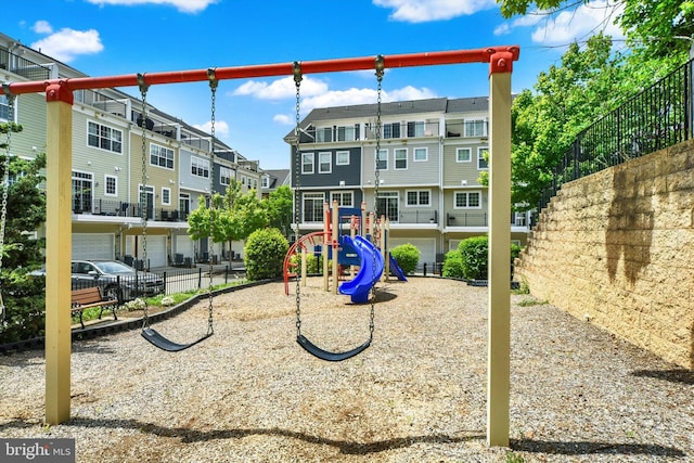 community jungle gym featuring a residential view and fence