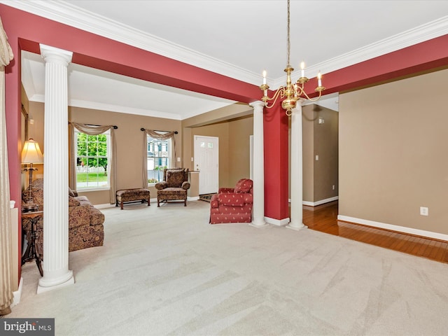 13241 Manor Dr S, Mount Airy, MD 21771 - living area with decorative columns, carpet flooring, ornamental molding, baseboards, and a chandelier