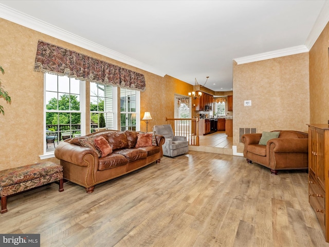 13241 Manor Dr S, Mount Airy, MD 21771 - living area featuring light wood-style flooring, a chandelier, and crown molding