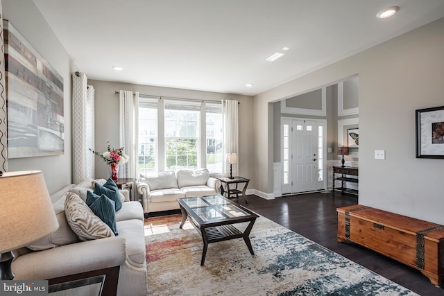 living room with wood finished floors, recessed lighting, and baseboards