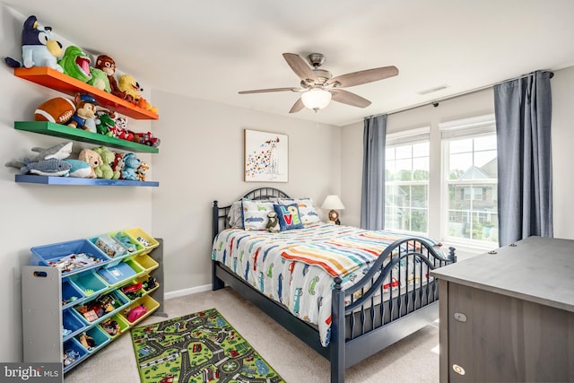 bedroom featuring carpet floors, a ceiling fan, and baseboards