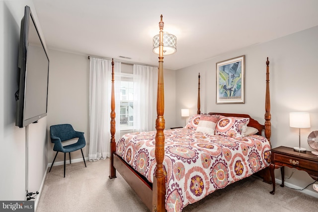 bedroom with carpet flooring and baseboards