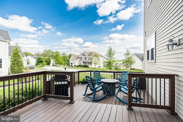 wooden deck featuring a residential view
