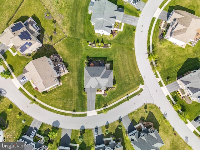 aerial view of property and surrounding area featuring nearby suburban area