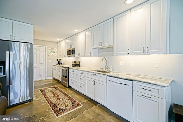 111 Seabright Way Unit E3, Rehoboth Beach, DE 19971 - kitchen featuring appliances with stainless steel finishes, a sink, white cabinetry, and recessed lighting