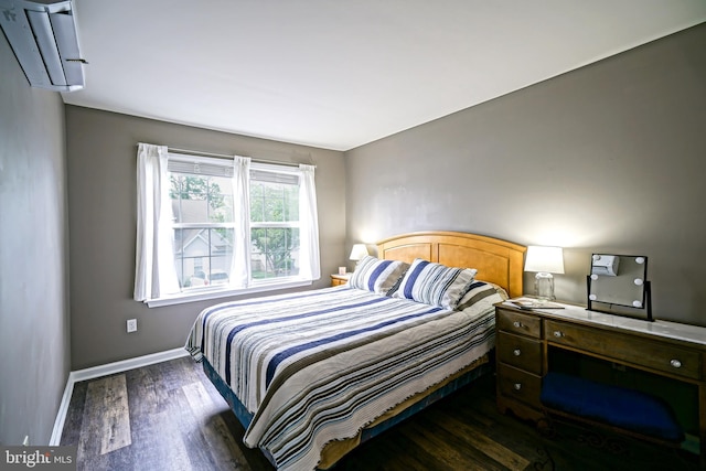 111 Seabright Way Unit E3, Rehoboth Beach, DE 19971 - bedroom with wood finished floors, a wall mounted air conditioner, and baseboards