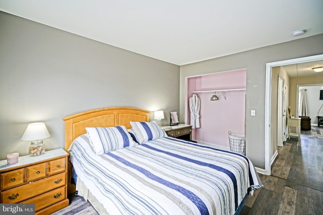 111 Seabright Way Unit E3, Rehoboth Beach, DE 19971 - bedroom with dark wood-type flooring, a closet, and baseboards