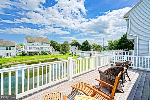 111 Seabright Way Unit E3, Rehoboth Beach, DE 19971 - deck featuring a water view, a swimming pool, and a lawn