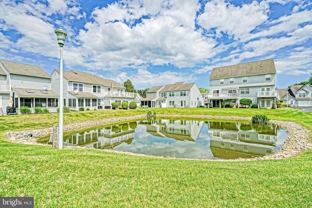 111 Seabright Way Unit E3, Rehoboth Beach, DE 19971 - surrounding community featuring a residential view, a water view, and a lawn