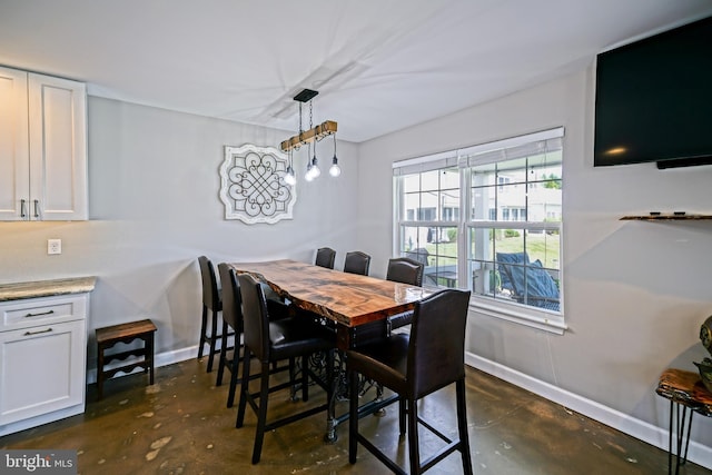 111 Seabright Way Unit E3, Rehoboth Beach, DE 19971 - dining area with unfinished concrete flooring and baseboards