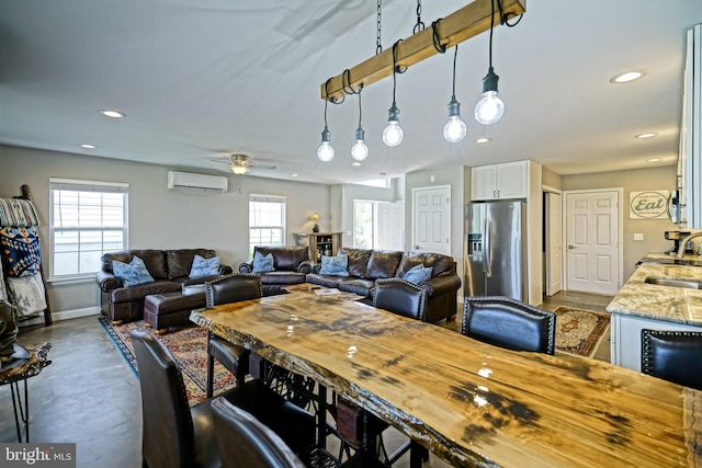 111 Seabright Way Unit E3, Rehoboth Beach, DE 19971 - dining area featuring a wall unit AC, concrete flooring, recessed lighting, baseboards, and ceiling fan