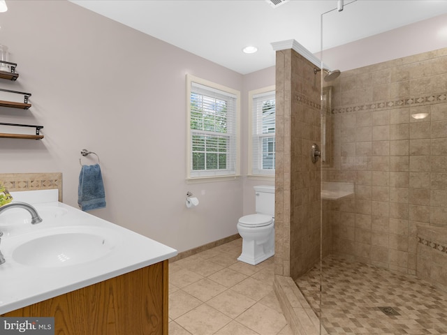 1904 Artillery Ln, Odenton, MD 21113 - full bath with tile patterned flooring, tiled shower, toilet, baseboards, and double vanity