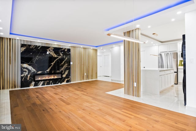 living room featuring light wood finished floors and recessed lighting