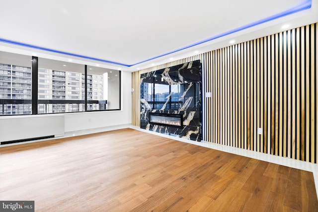 unfurnished room with wood finished floors and recessed lighting