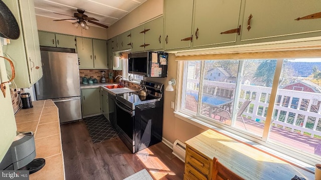 648 E 3rd St, Bloomsburg, PA 17815 - kitchen with appliances with stainless steel finishes, a sink, plenty of natural light, and baseboard heating