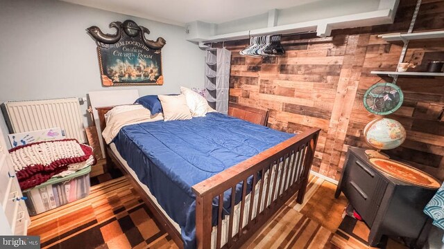 648 E 3rd St, Bloomsburg, PA 17815 - bedroom with wooden walls and wood finished floors