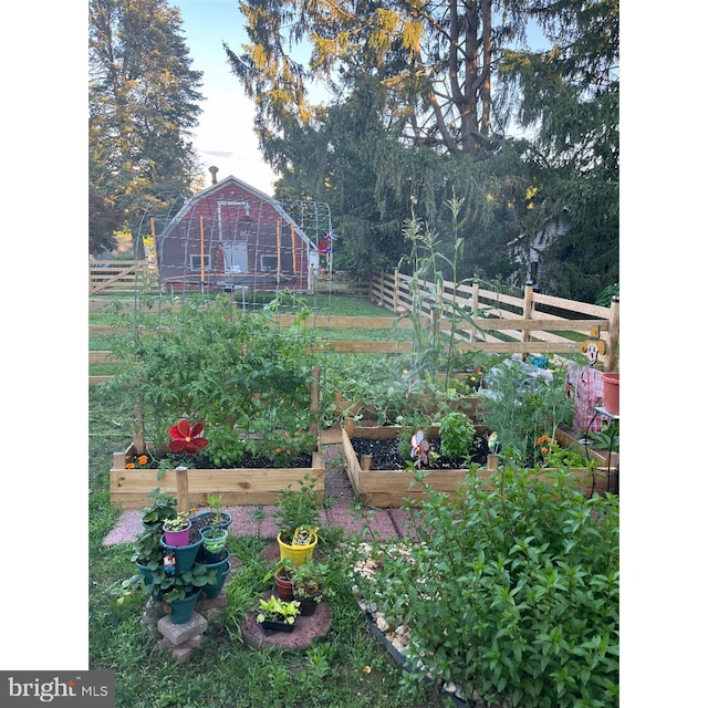 648 E 3rd St, Bloomsburg, PA 17815 - view of yard with a vegetable garden and fence