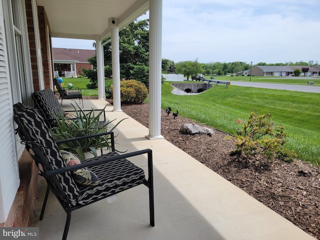 view of patio featuring a porch