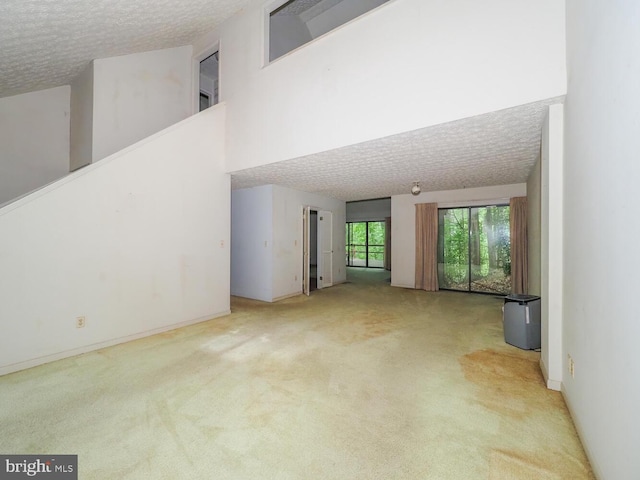 524 Ridge Rd, Annapolis, MD 21401 - unfurnished living room with carpet, a textured ceiling, and baseboards