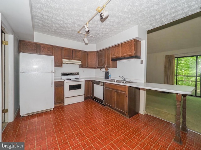 524 Ridge Rd, Annapolis, MD 21401 - kitchen with white appliances, under cabinet range hood, brick patterned flooring, light countertops, and a textured ceiling