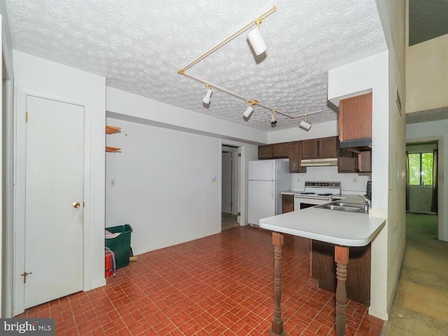 524 Ridge Rd, Annapolis, MD 21401 - kitchen with white appliances, a sink, under cabinet range hood, light countertops, and a kitchen breakfast bar