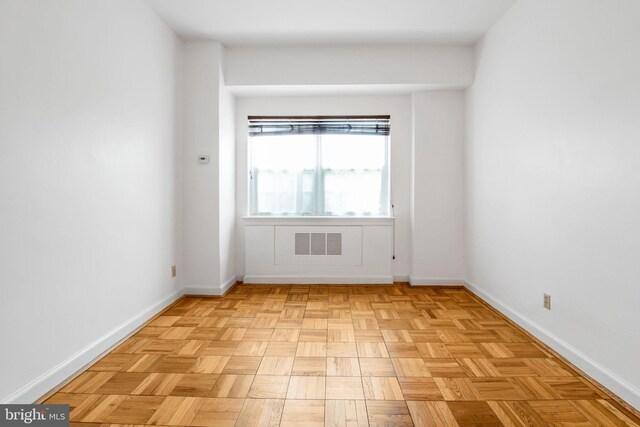 unfurnished room featuring baseboards