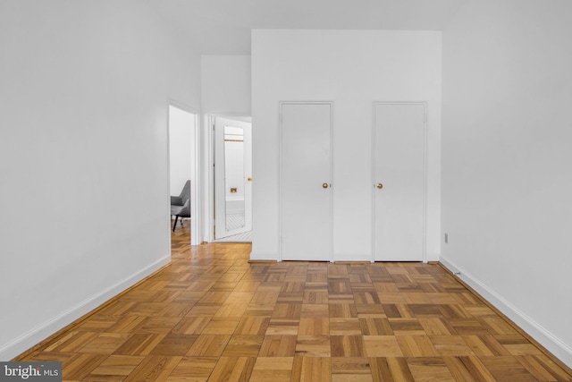 spare room featuring baseboards