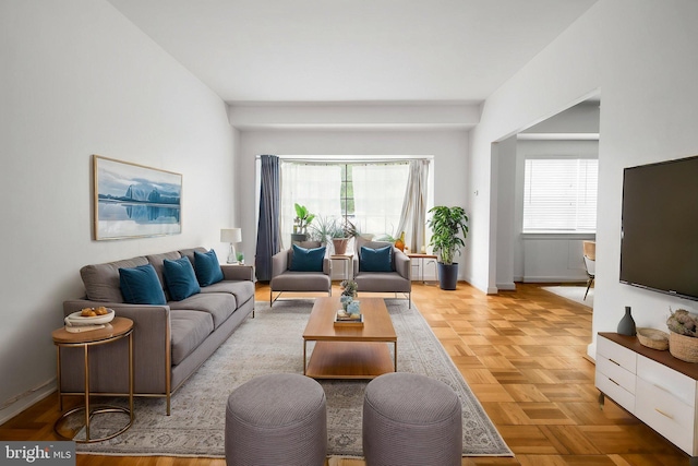living room featuring baseboards