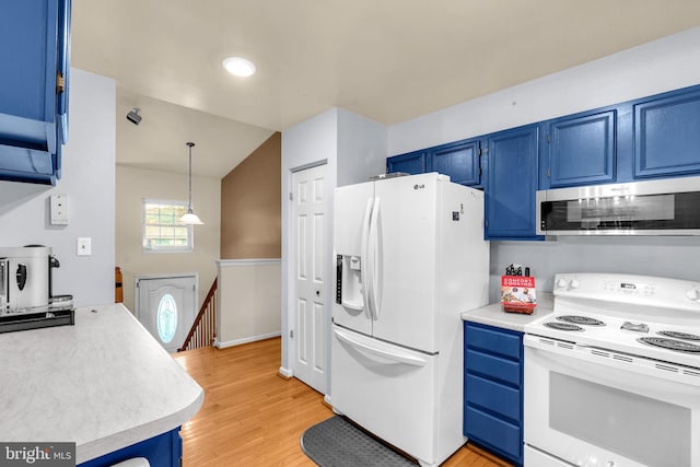 kitchen featuring white appliances, blue cabinets, light countertops, light wood-type flooring, and hanging light fixtures