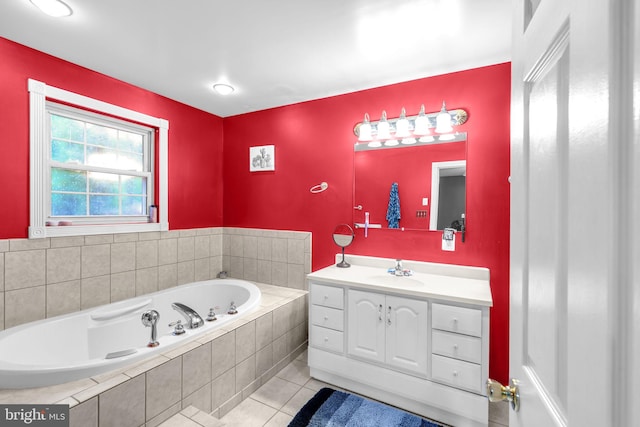 bathroom featuring tile patterned floors, vanity, and a garden tub