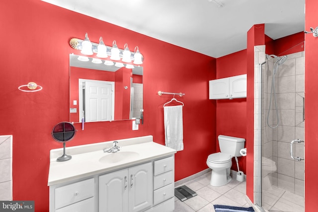 bathroom featuring toilet, a stall shower, tile patterned flooring, and vanity